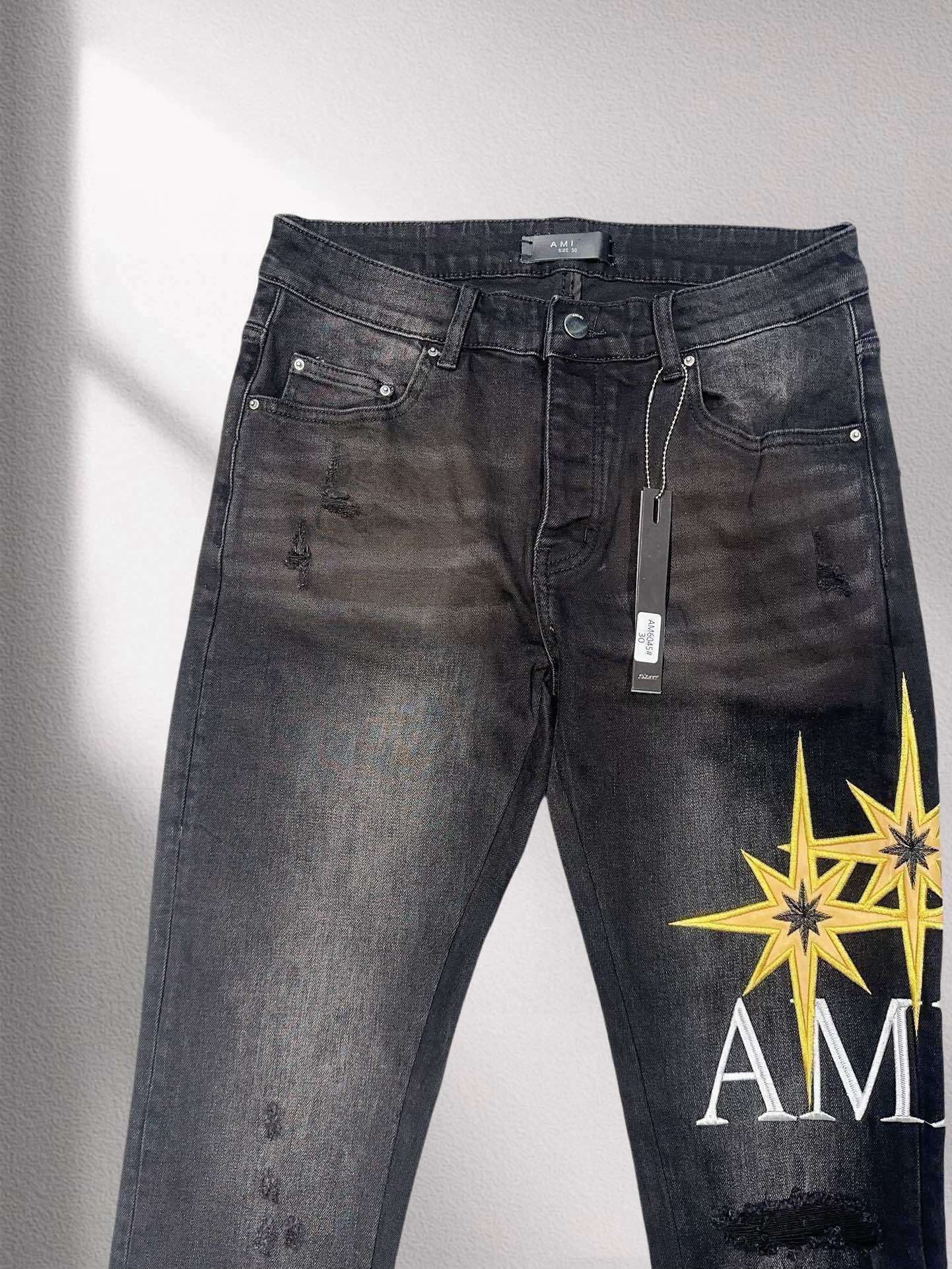 AMIR Black Jeans – Star Graphic with Signature Logo Detail